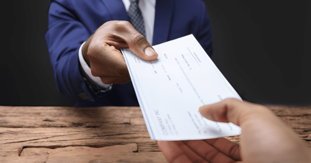 salary cheque being handed over